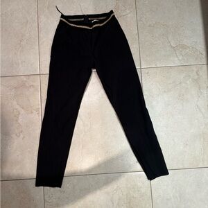 Stella McCartney Vivian Zip skinny black pants with gold waist accent.